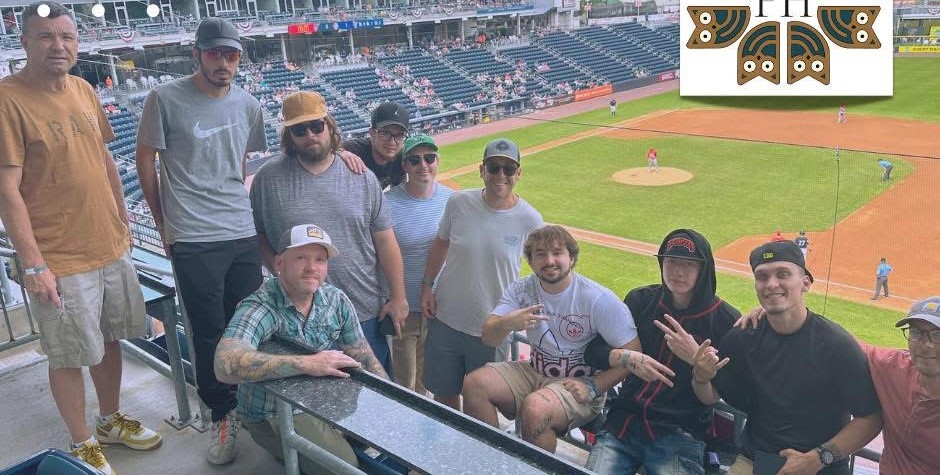 A Fellowship House group together at a baseball game